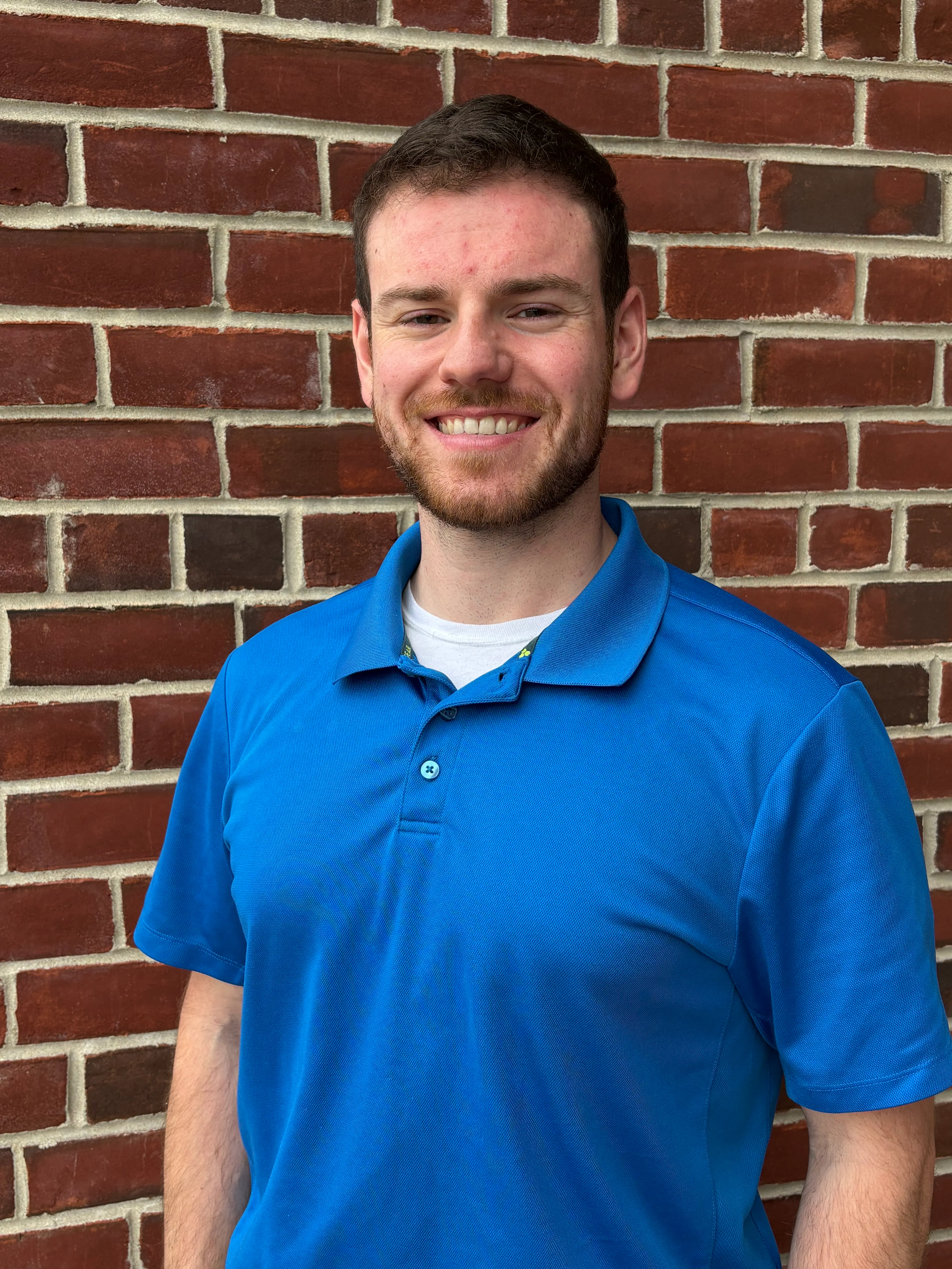 Man with a beard and wearing a blue shirt