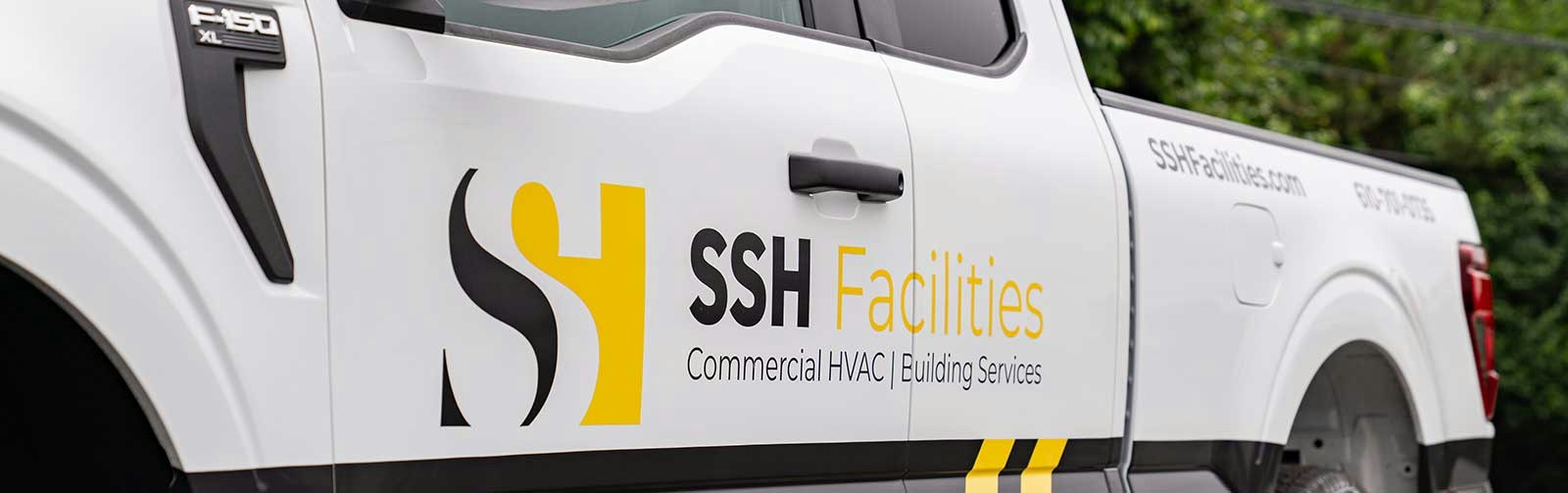 SSH Facilities commercial HVAC and building services company truck with branded logo parked outdoors.