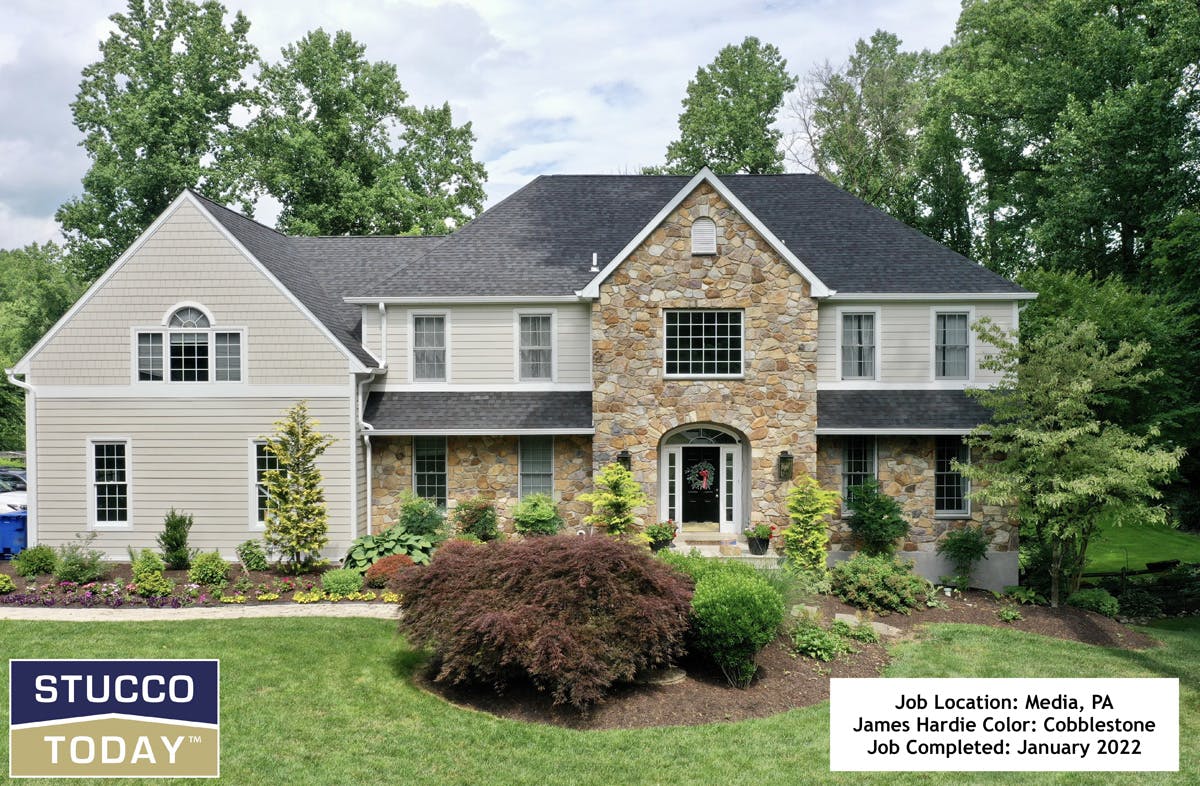 large suburban house with stucco remediation completed