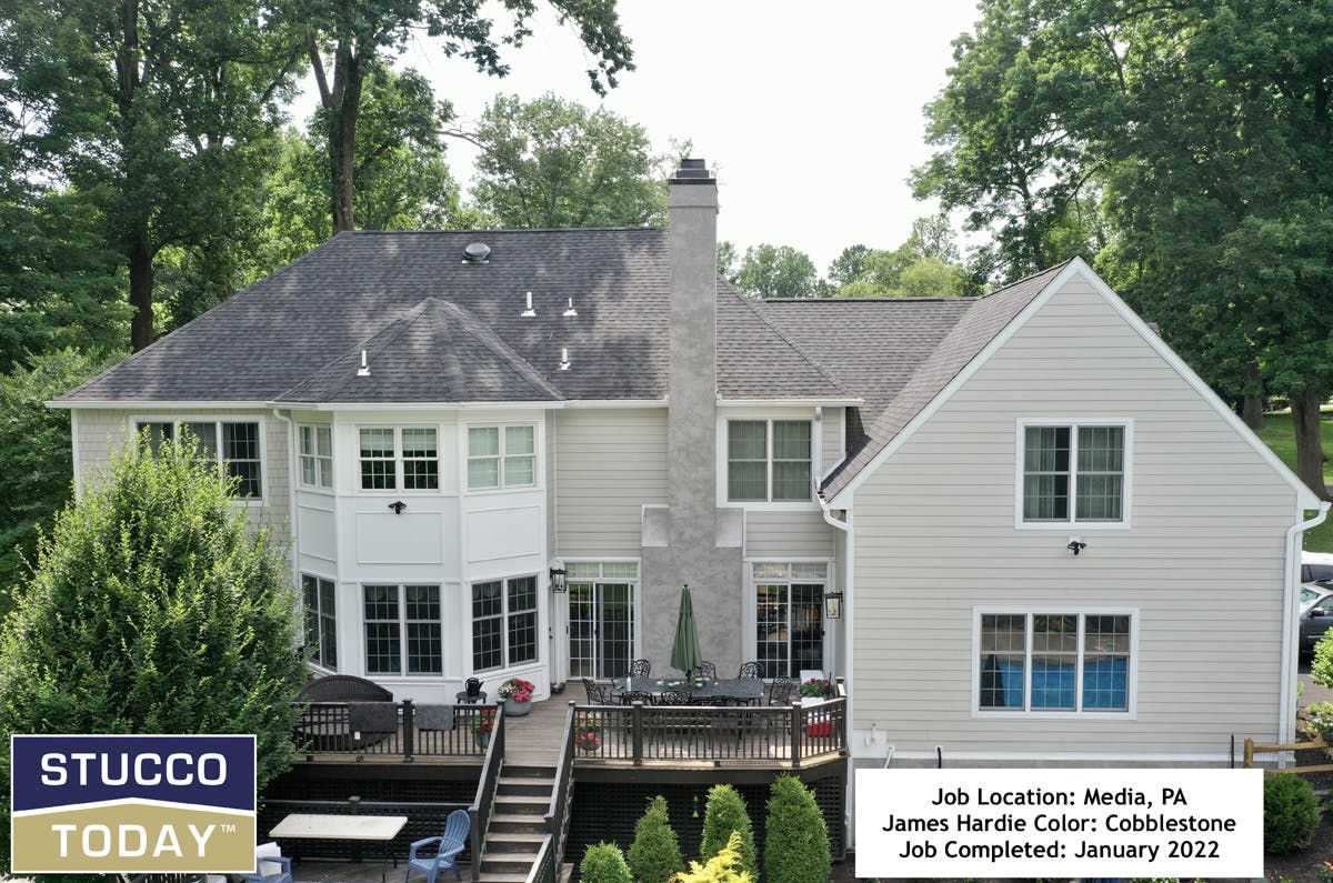 large suburban house with stucco remediation completed