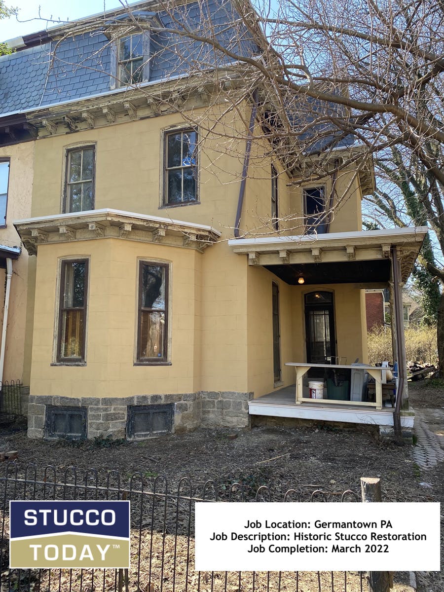 large suburban house with stucco remediation in completed