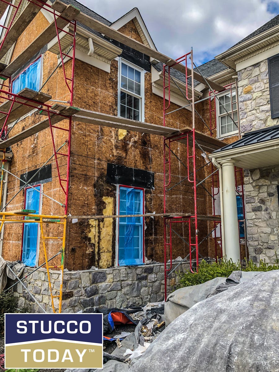 large suburban house with stucco remediation completed