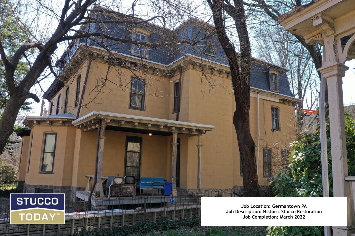 large suburban house with stucco remediation in completed