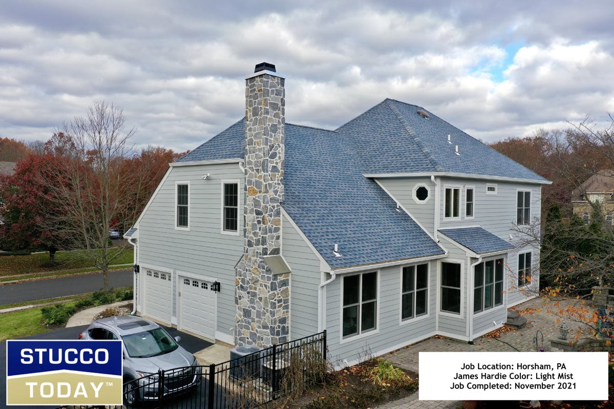 large suburban house with stucco remediation completed