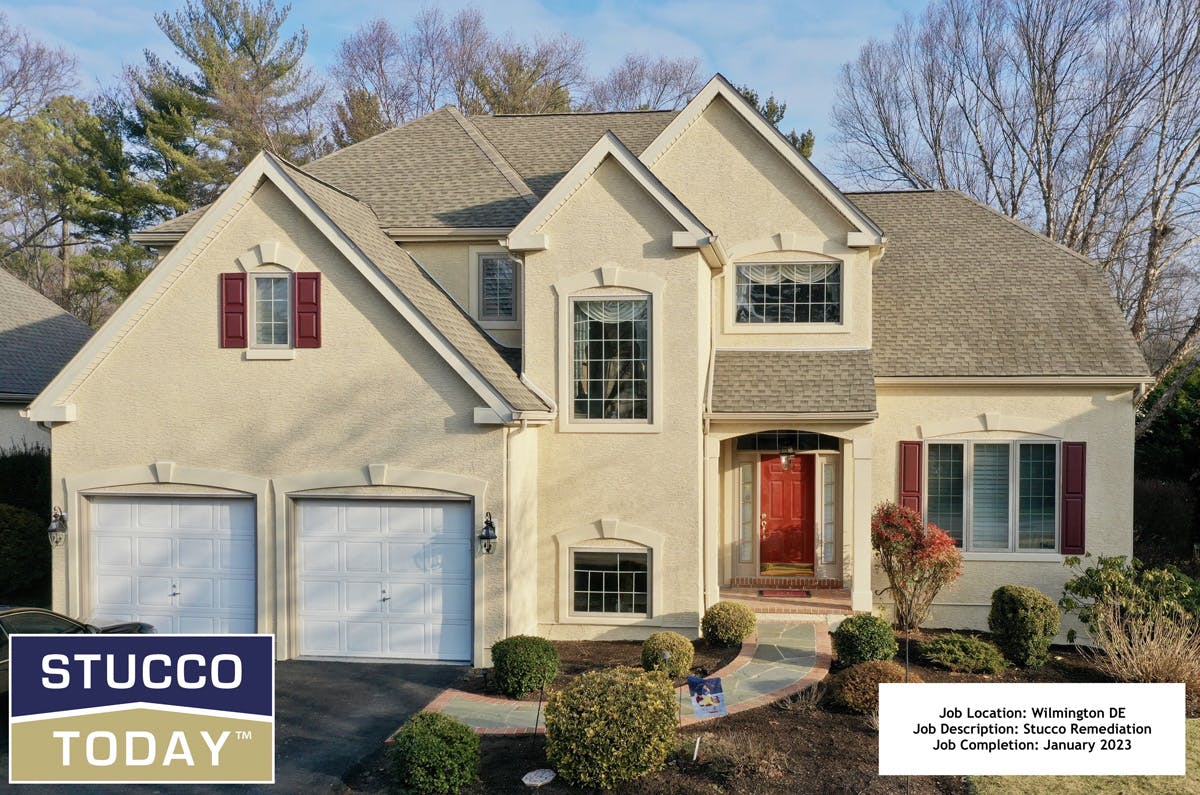 large suburban house with stucco remediation completed