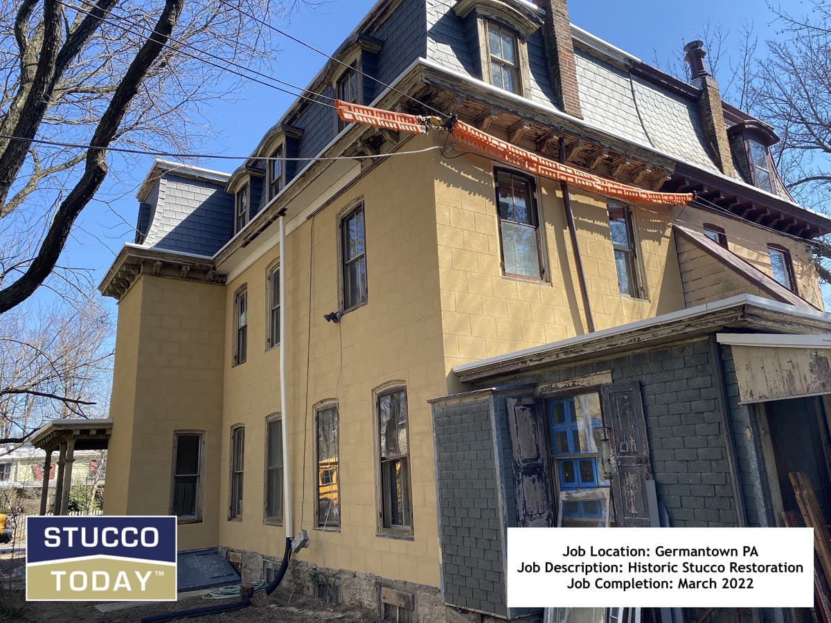 large suburban house with stucco remediation in completed