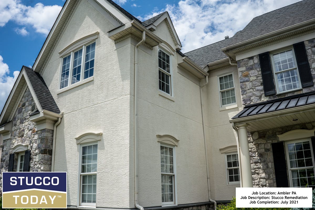 large suburban house with stucco remediation in completed