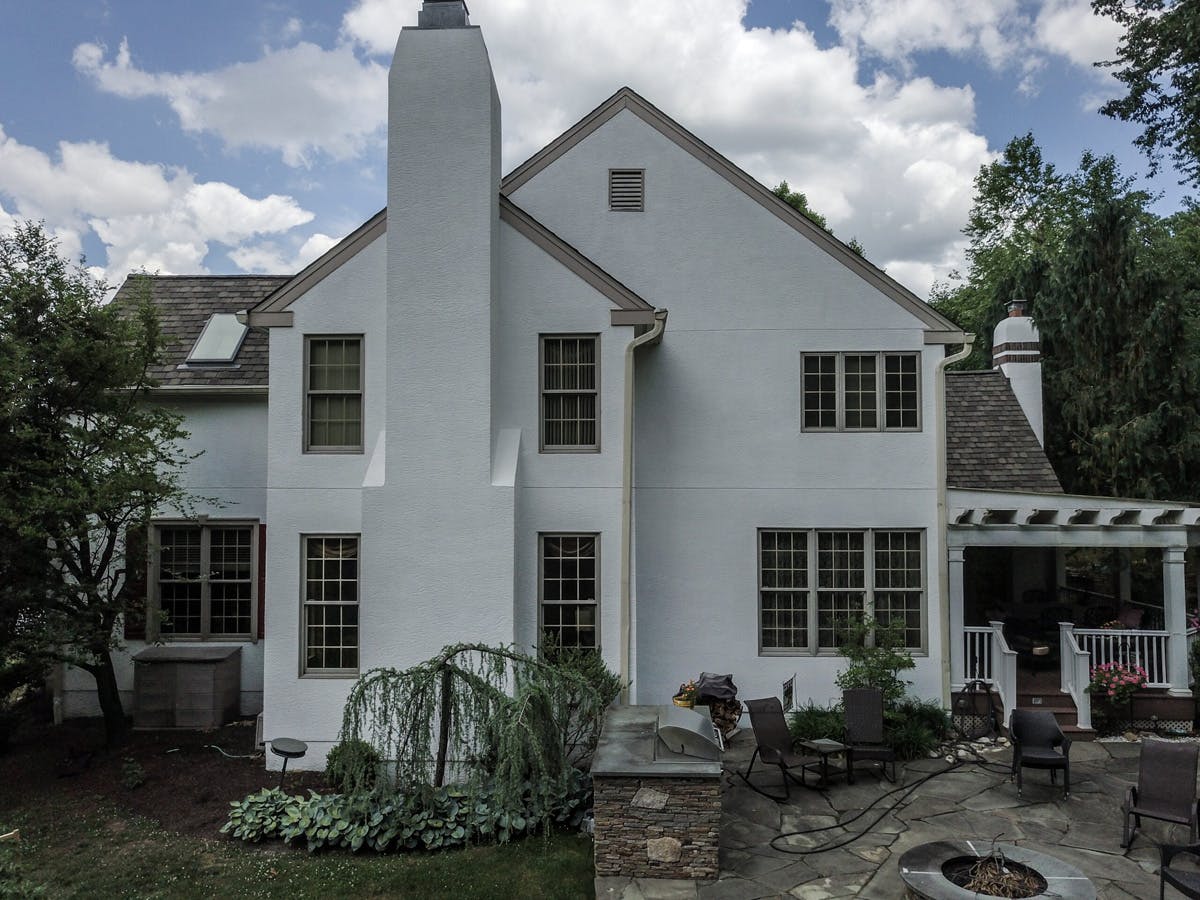 two story suburban house with completed stucco remediation