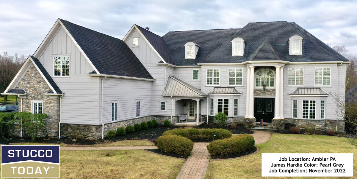 large suburban house with stucco remediation completed