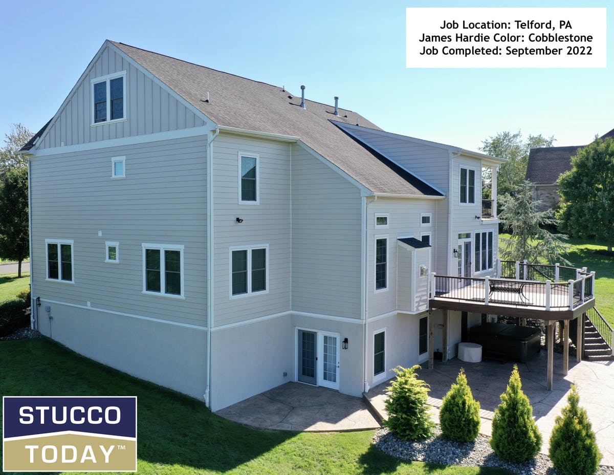 large suburban house with stucco remediation completed