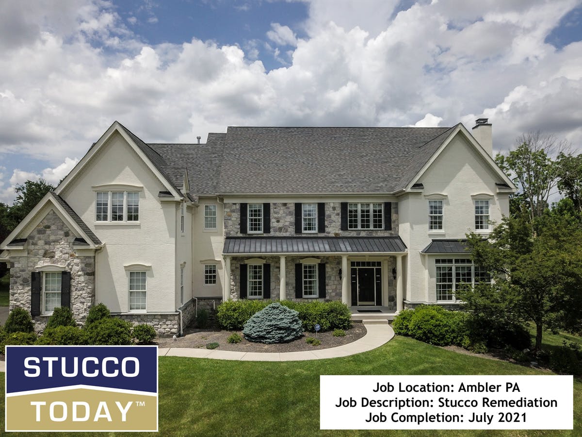 large suburban house with stucco remediation in completed