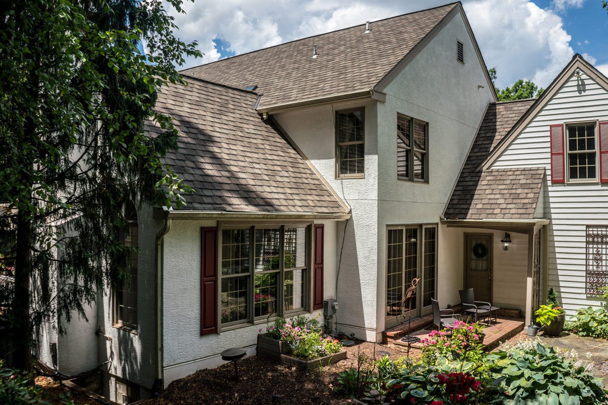 two story suburban house with completed stucco remediation