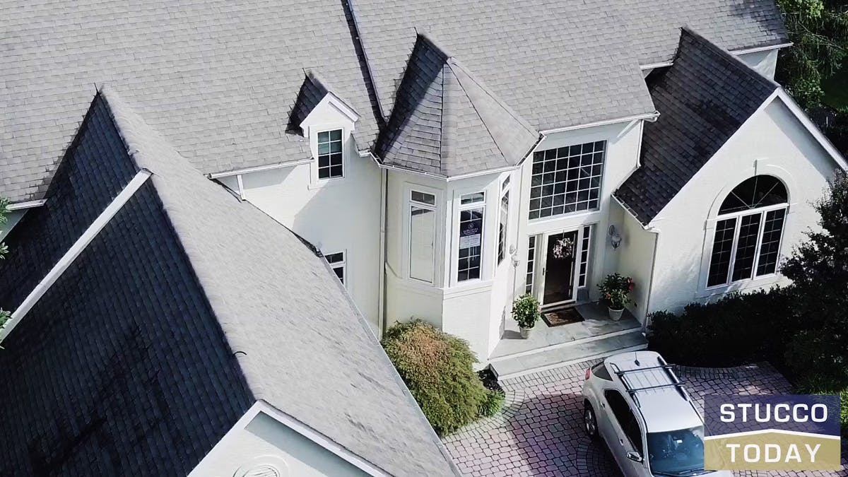 stucco remediation for large, two story, white suburban house in ambler, pa