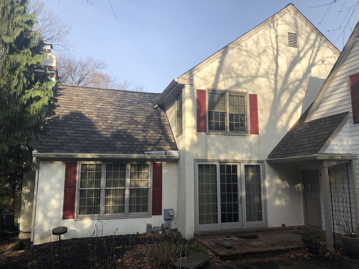 two story suburban house with completed stucco remediation