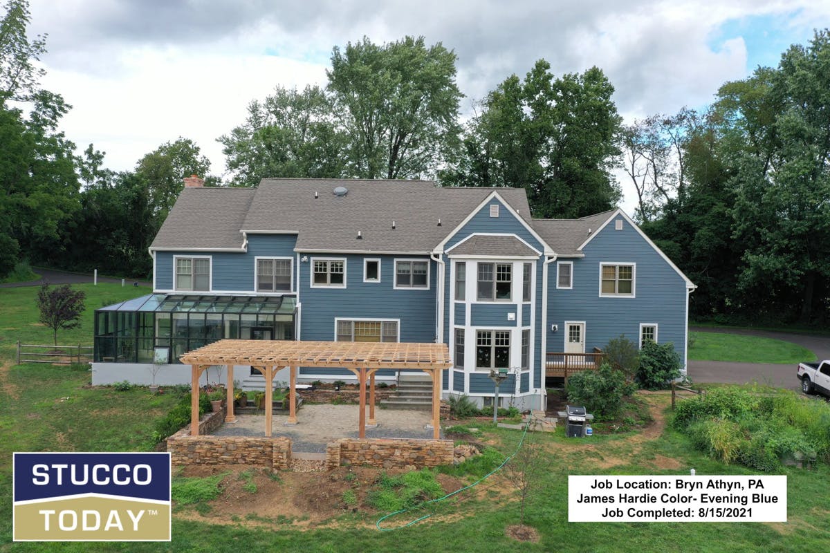 large suburban house with stucco remediation completed