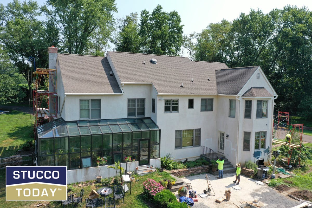 large suburban house with stucco remediation completed