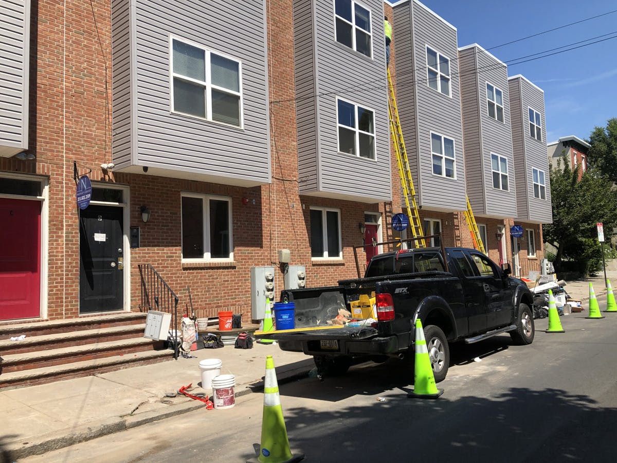 townhouse with in progress stucco remediation