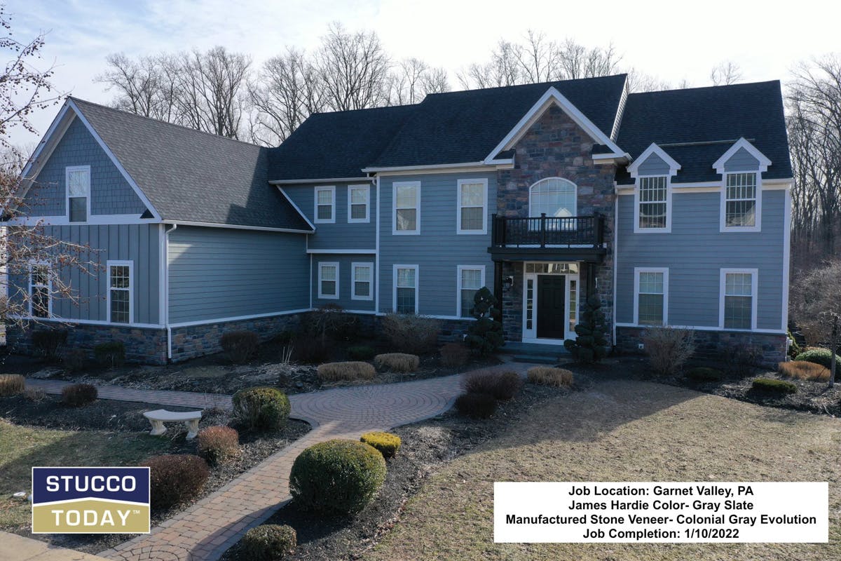 suburban house with stucco remediation completed