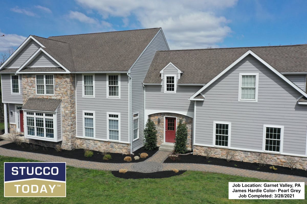 suburban house with stucco remediation completed