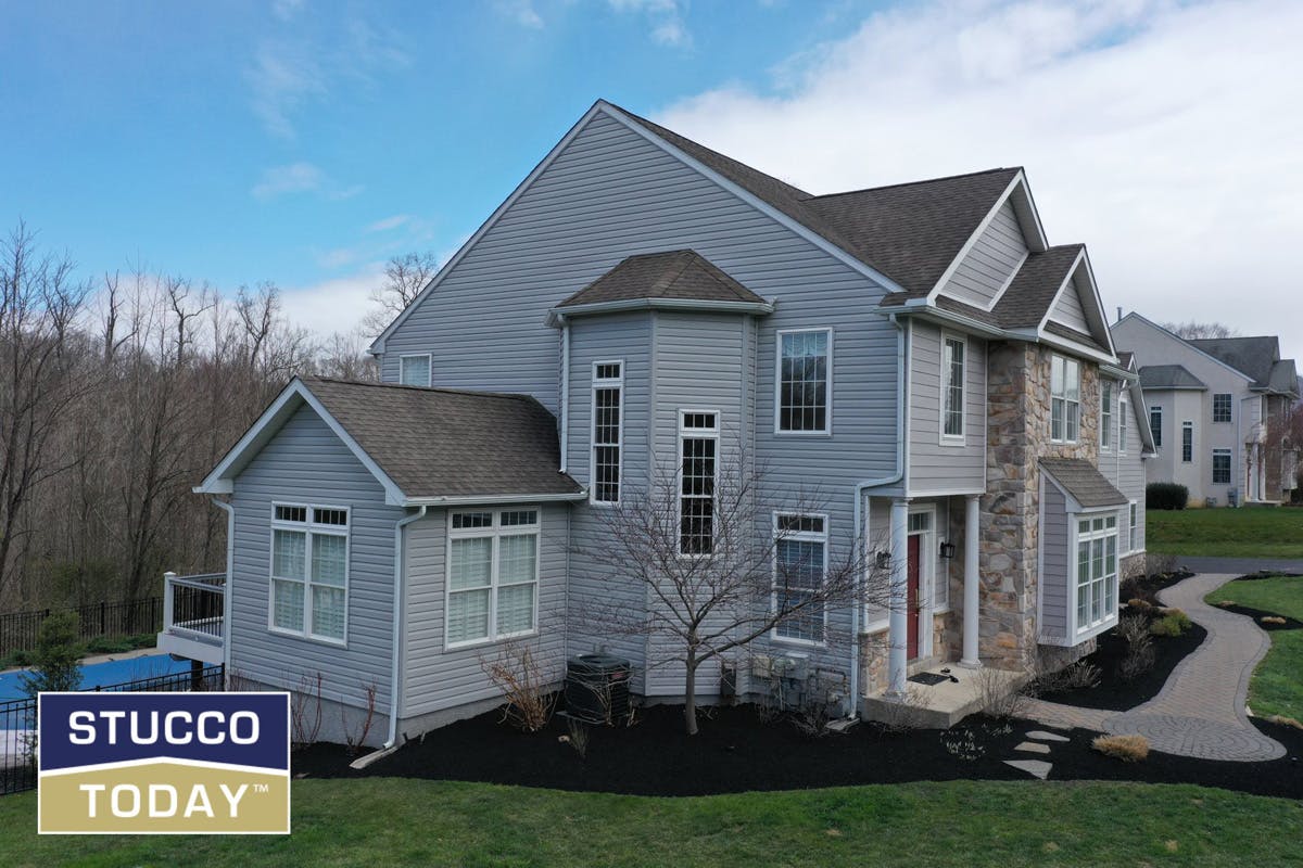 suburban house with stucco remediation completed